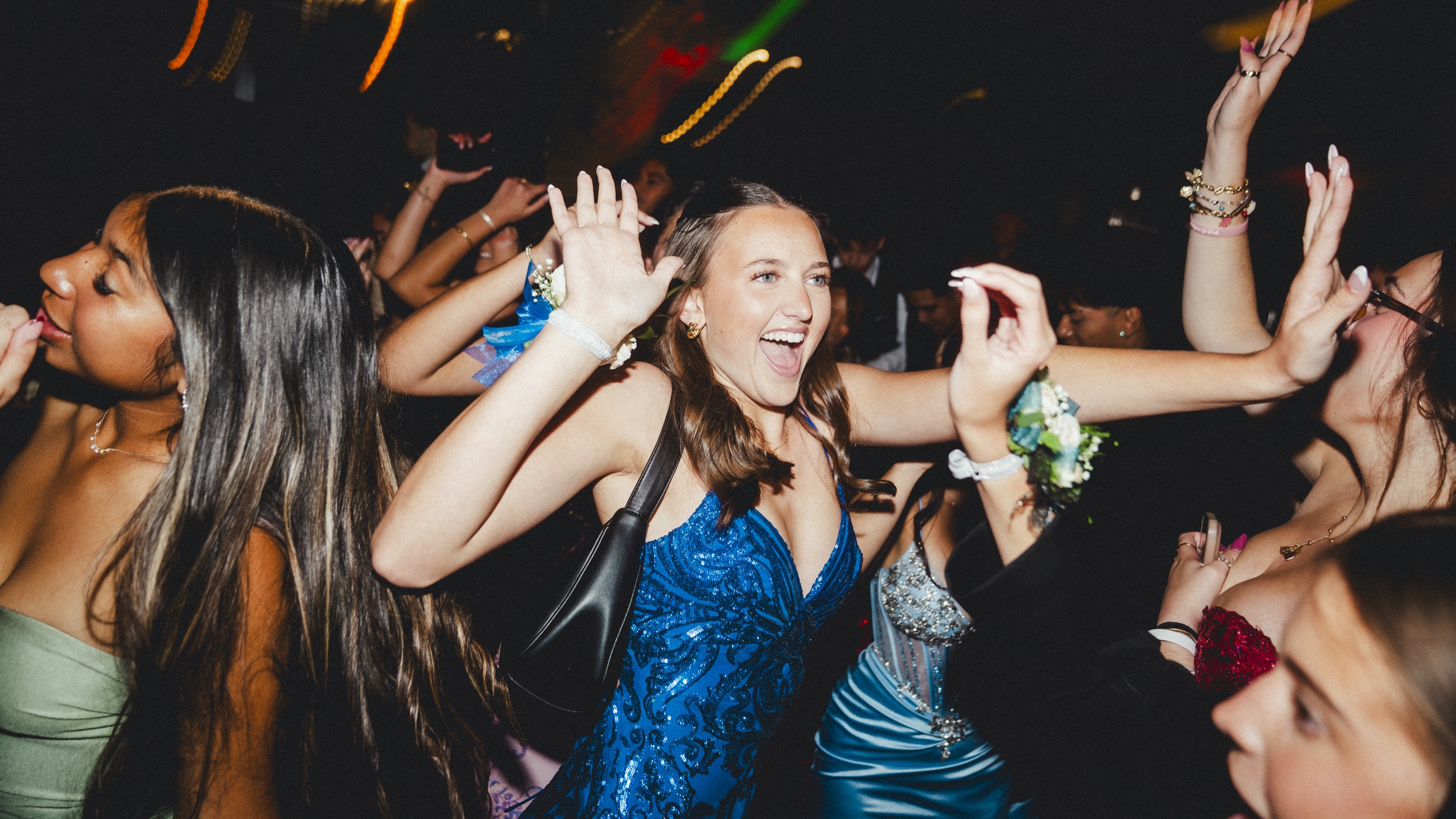Students celebrating together on the dance floor at prom