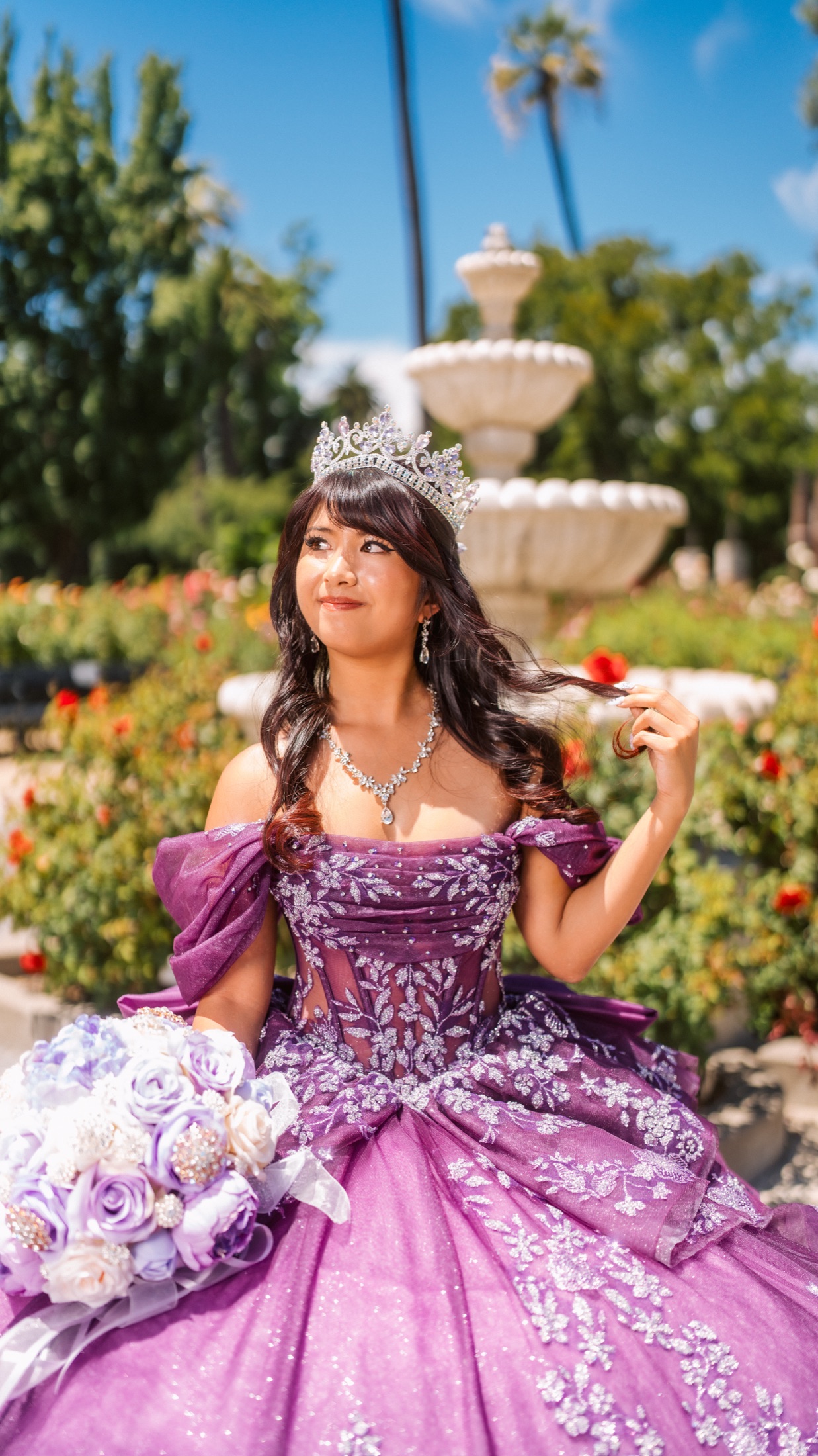 Quinceañera portrait in a purple gown and tiara